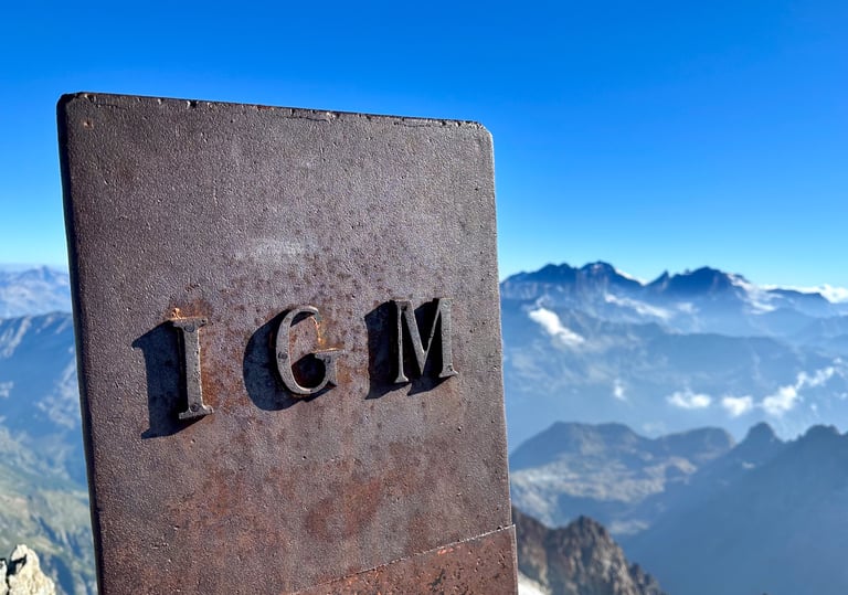 On the summit of Monte Disgrazia, with Piz Bernina in the background. Valmasino - Italy