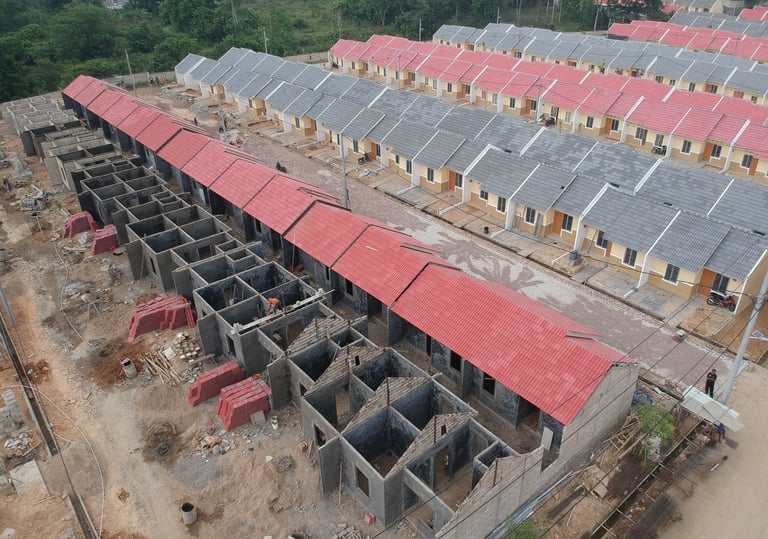 a building with a red roof and a black roof  Distributor Pralon