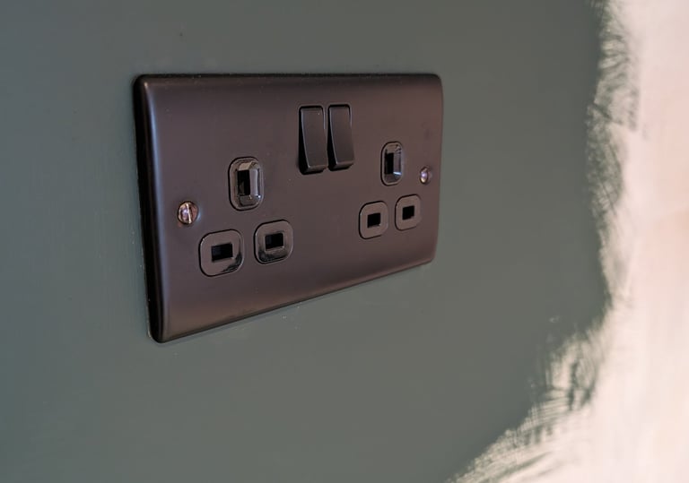 a black and white electrical outlet in a wall