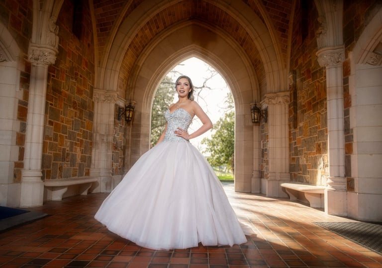 quinceanera in a white dress standing in a archway