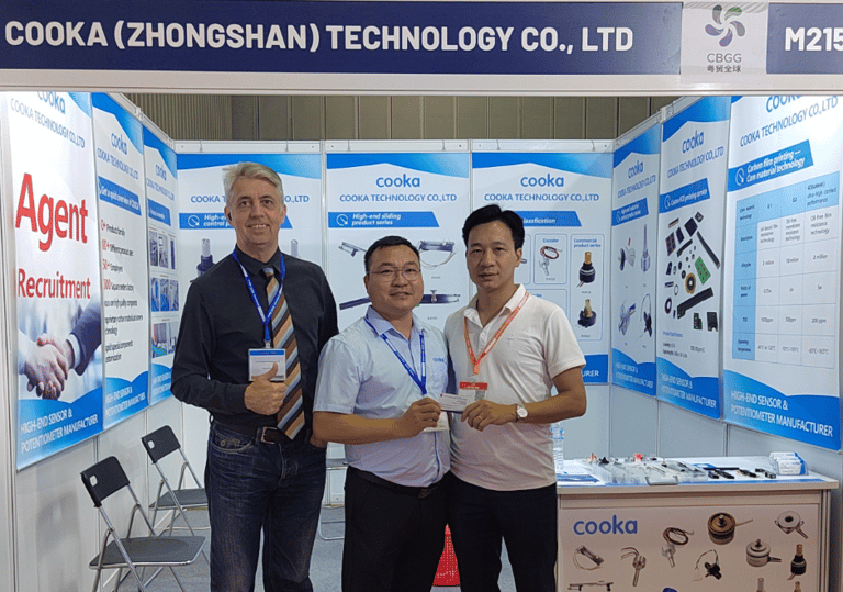 three men standing in front of a display of a display of a display of a