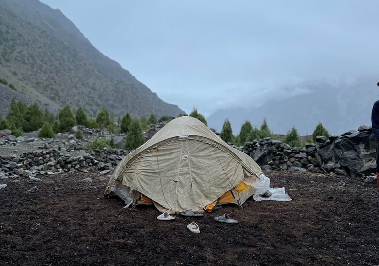 A white tent in the mountains