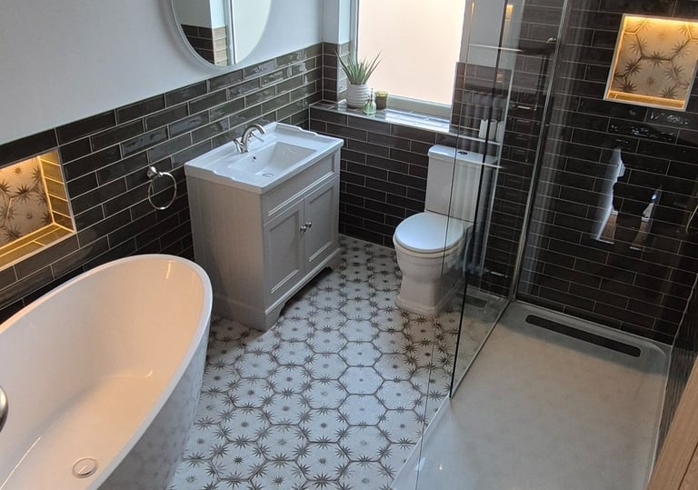 Modern bathroom with a freestanding bathtub, glass walk-in shower, and patterned star tile flooring.