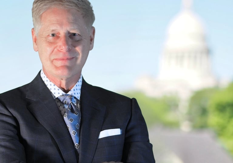 Arkansas Wrongful Death Lawyer Gene Ludwig poses in front of State Capital Building