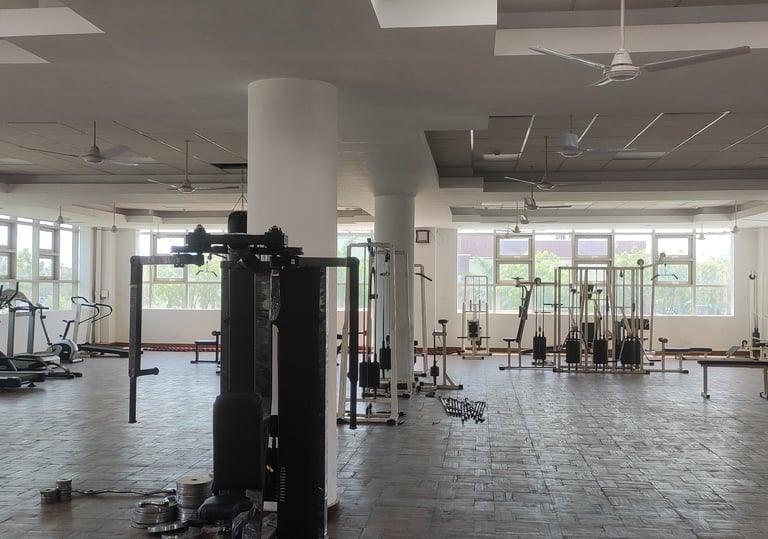 a gym with a lot of exercise equipment