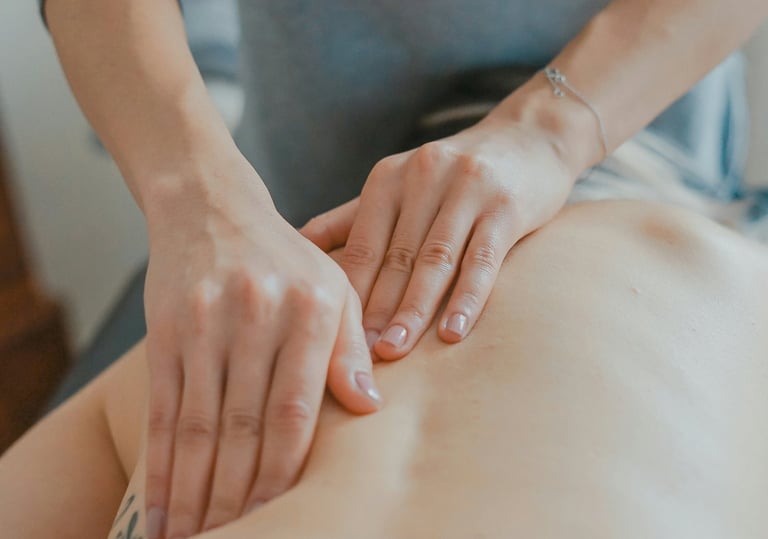 hand massaging woman's body