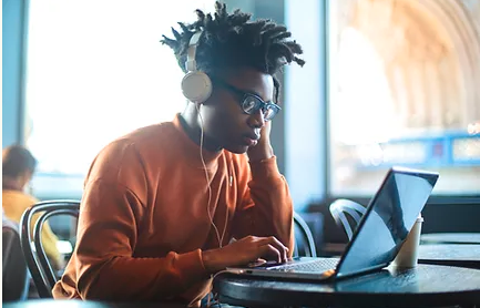 teen boy using laptop