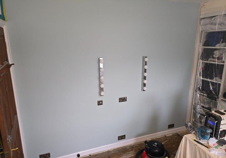 Sockets and vanity lighting installed in a bedroom in Grays by Easy Spark Ltd