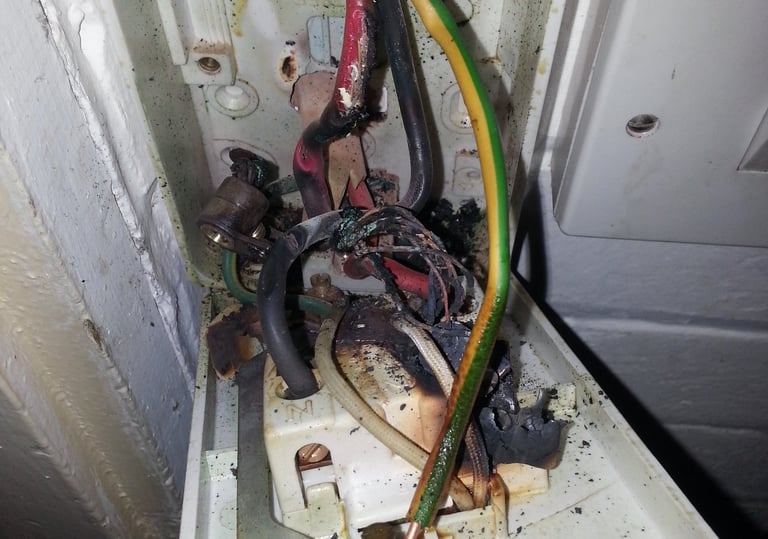 Electrical fault finding revealing heat damage inside a 45A shower isolator switch