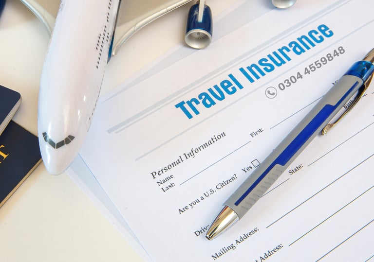 a pen on travel insurance paper