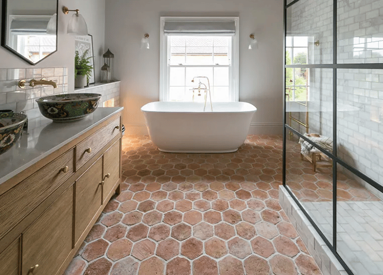 Terracotta bathroom floor, giving the space warmth and calming effect