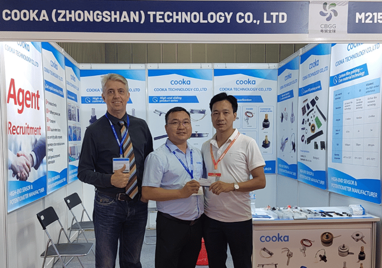 three men standing in front of a display of a display of a display of a