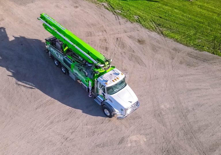 a green crane truck with a crane on it