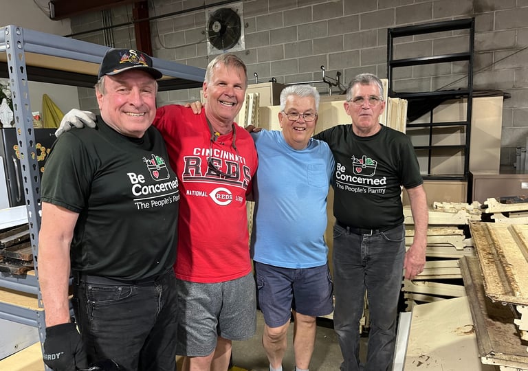Rose Garden Volunteers working in the warehouse and enjoying each other's company.