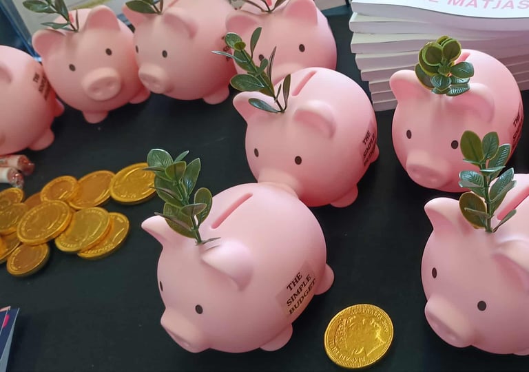 The Simple Budget Piggy Banks with gold coins