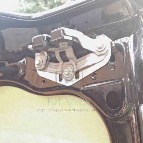 Van barn door latch shield