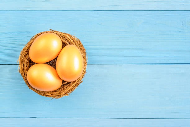 a basket of eggshells in a basket on a blue wooden table