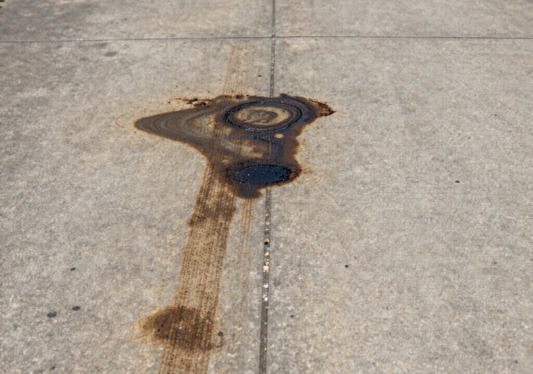 Laser cleaning a driveway oil stain