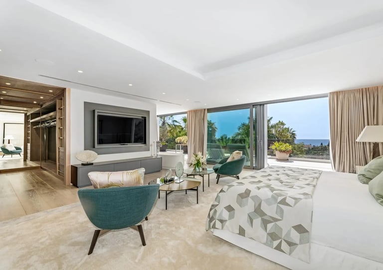 Elegant suite with seating and terrace at Villa Serenity