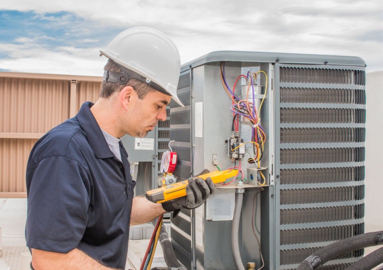 a man in a hard hat and a yellow helmet