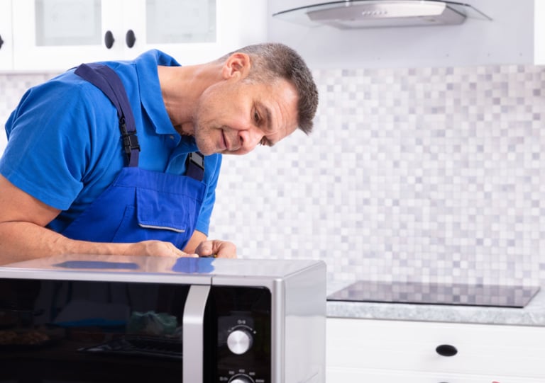a man in a blue shirt and blue overall overall overall overall overall overall overall overall