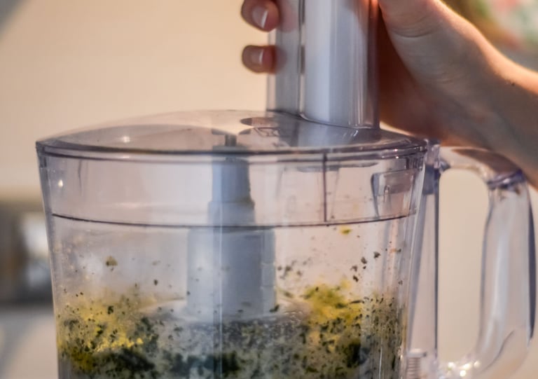 a person is holding a blender in a blender