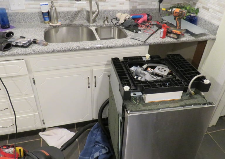 a kitchen with a stove top and a sink