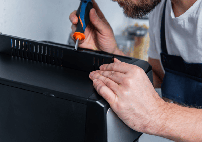 a man in overalls and overalls is using a pair of scissors and a