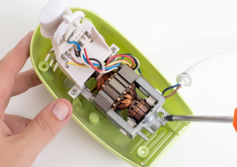 a person holding a small device with wires and wires