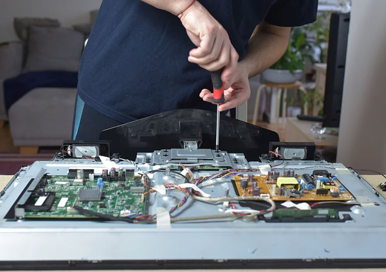 a man is holding a pair of scissors and a pair of scissors