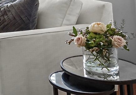a vase with flowers on a table