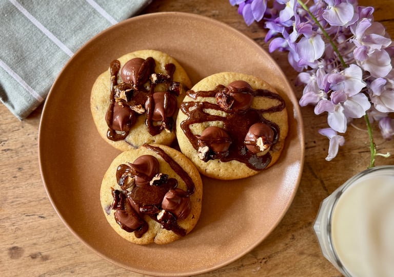 a plate with cookies and milk on a plate