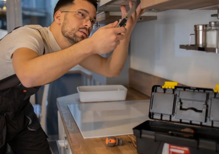 handyman fixing oven in squamish