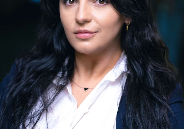 a woman with long hair and a white shirt