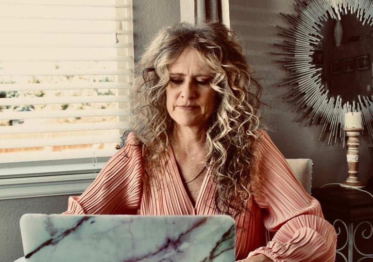 nail tech reviewing salon policies and client boundary guidelines at her workstation