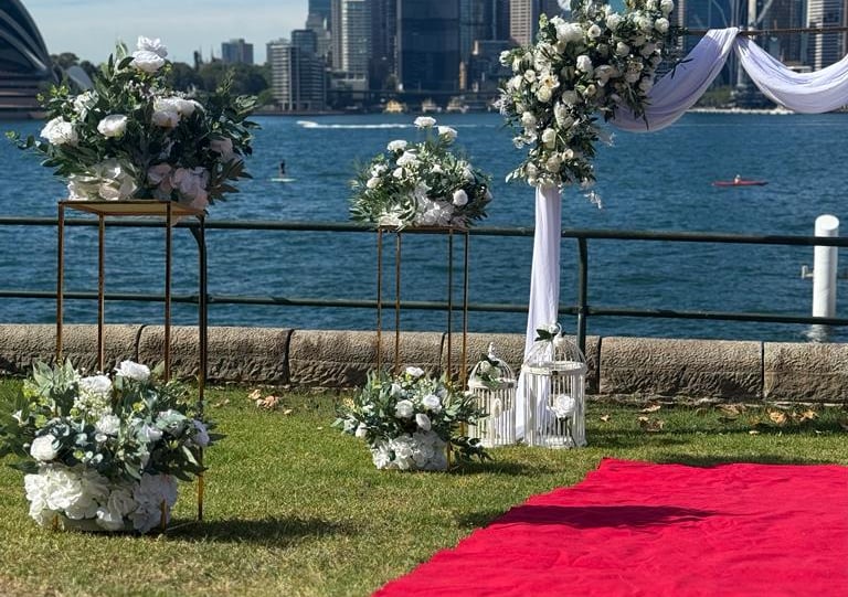 a wedding ceremony with a red carpet and a red carpet