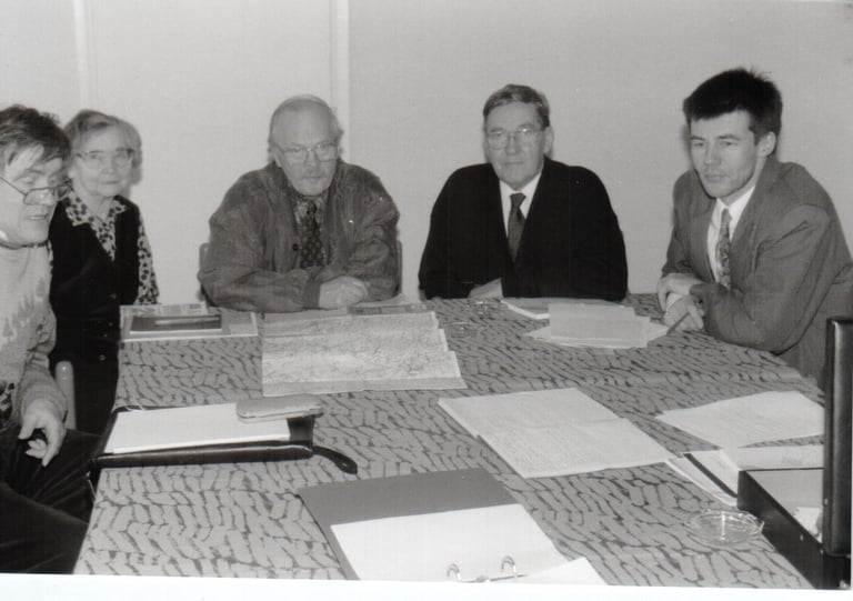 a group of people sitting around a table