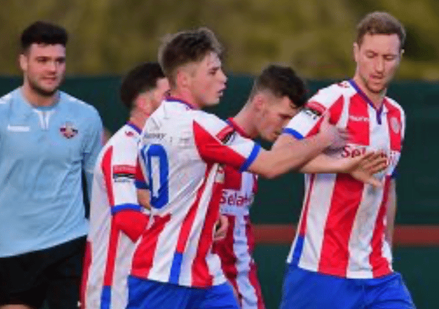 Robb Sheridan, semi professional footballer, celebrating with teammates during a match.