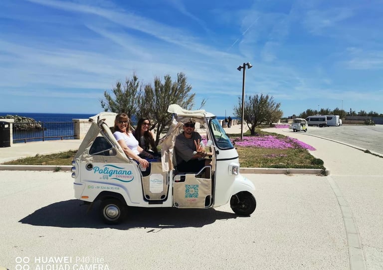 ape calessino with passengers on the coast