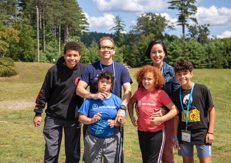 a family posing for a picture in a field