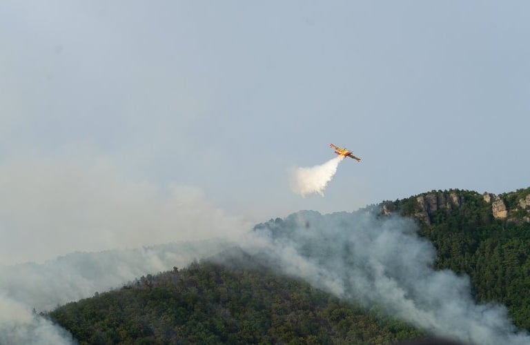 Canadair releasing water on the fire