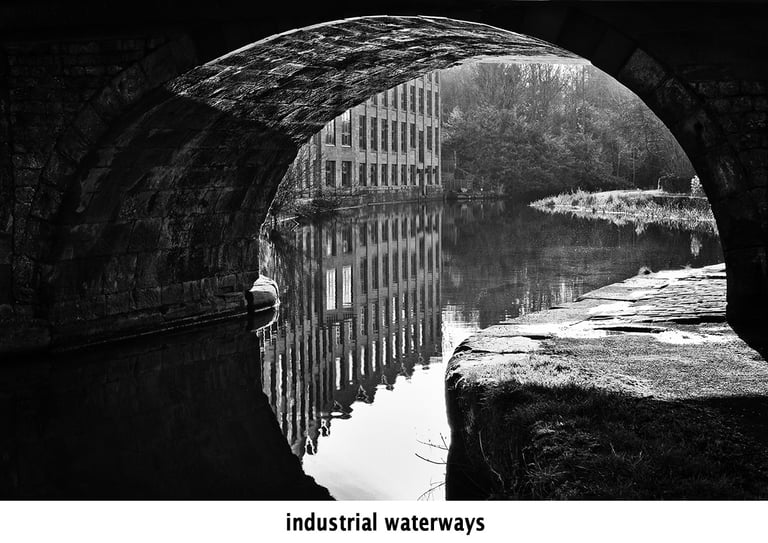 a bridge over the leeds and liverpool canal in black and white