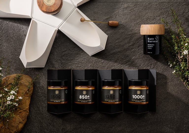 Product photography - a variety of honey products styled on a stone tile
