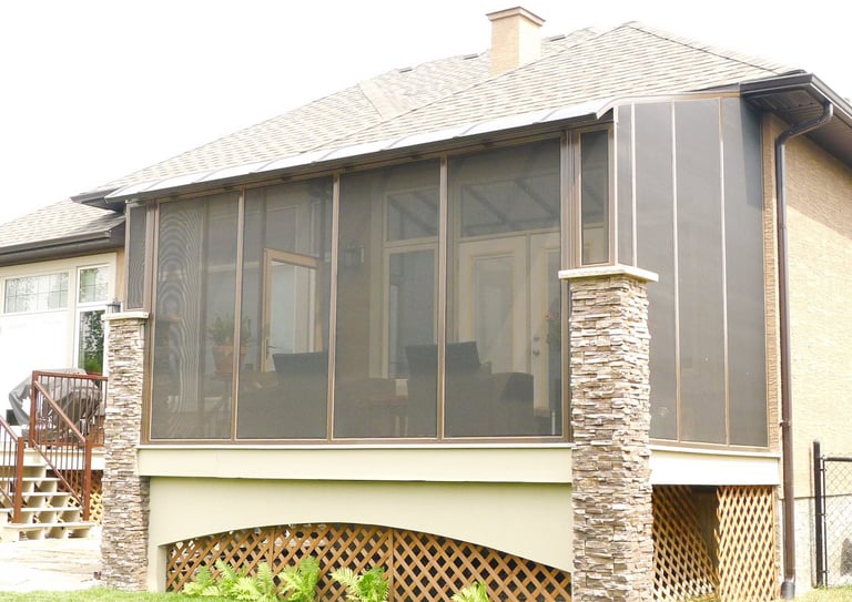 Screen Room with patio cover and brown frame.