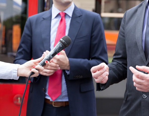 business-executives-answer-news-media-questions-at-impromptu-news-interview