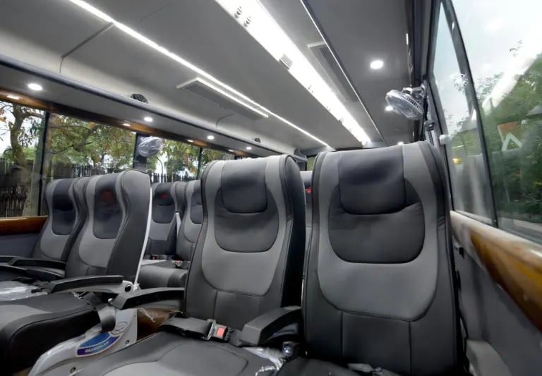 29 seater luxury bus interior for group travel in Delhi by Bus Suvidha