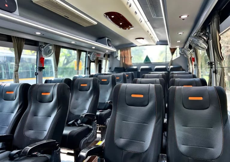 27 seater luxury bus interior with comfortable seating in Delhi NCR
