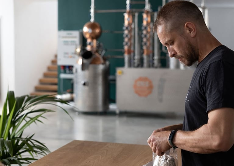 master distiller is sampling botanicals