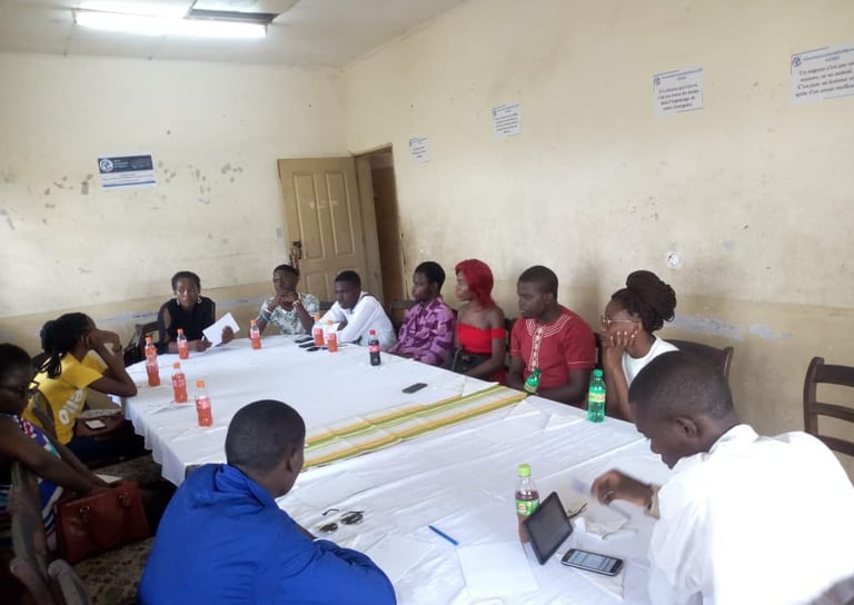 a group of people sitting around a table