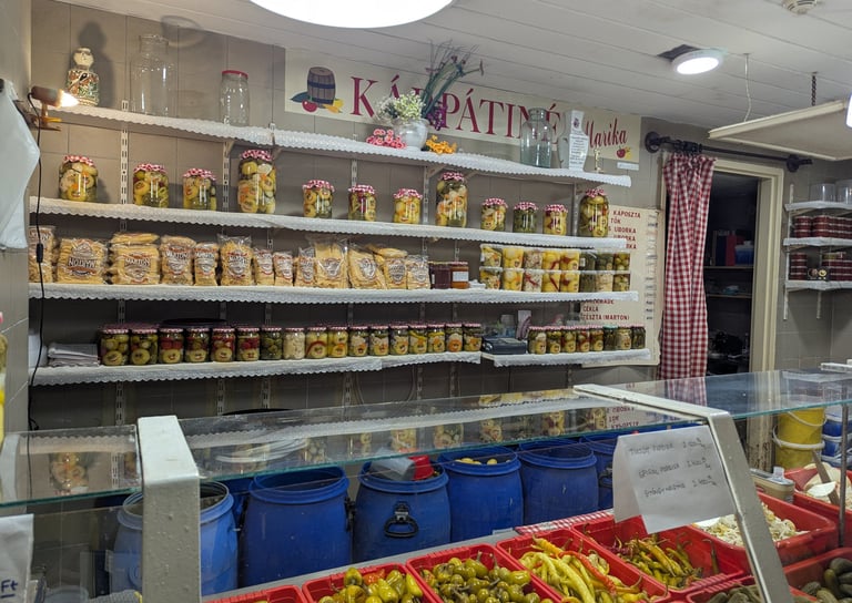 colorful and beautifully arranged homemade pickles in a vendor's display in the Great Market Hall